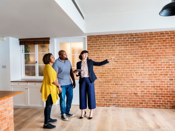 Realtor showing a house to a couple